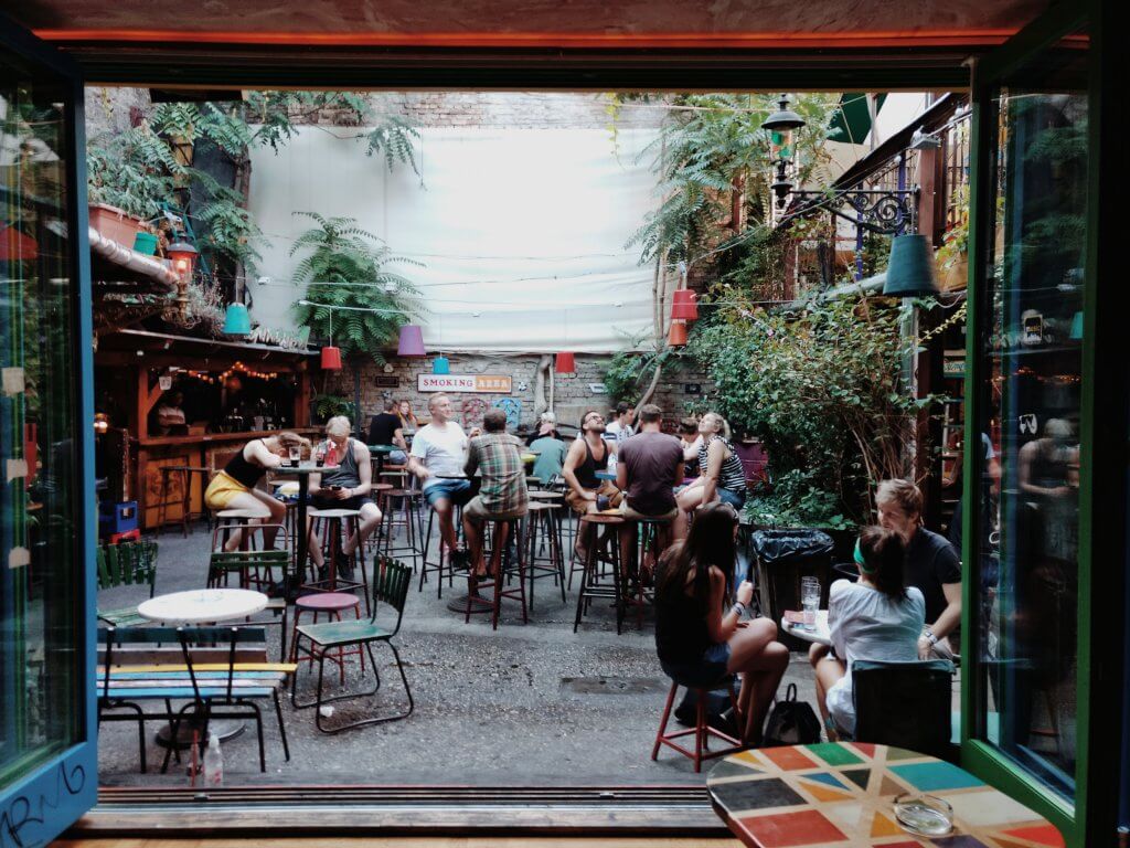 people drinking in a Budapest bar