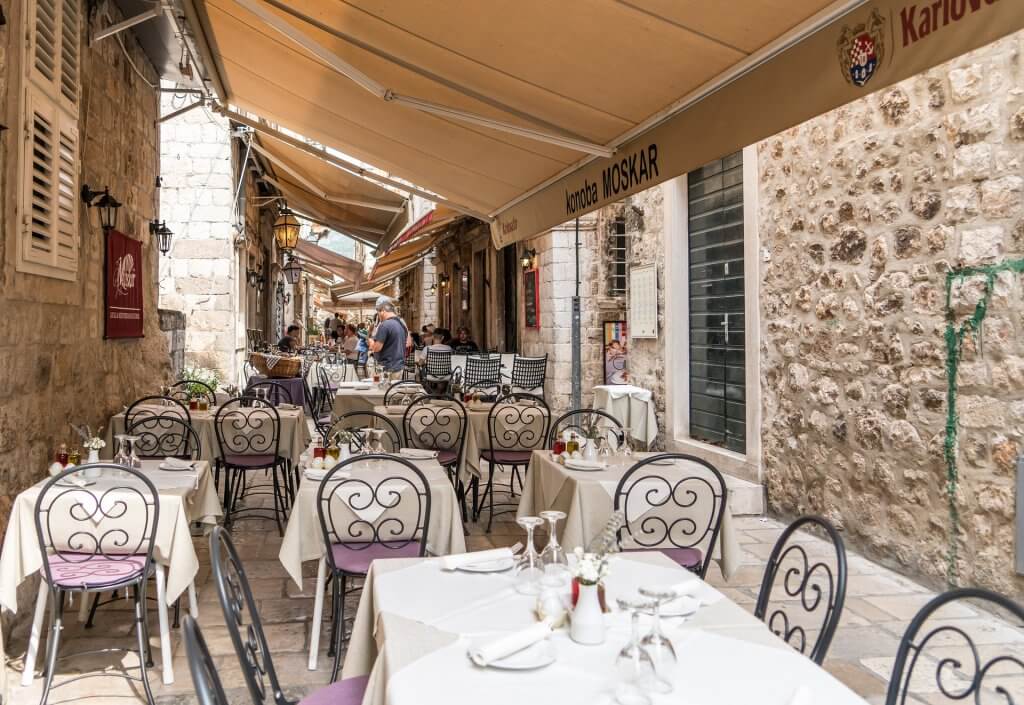 outdoor dining area in a narrow alley in Croatia