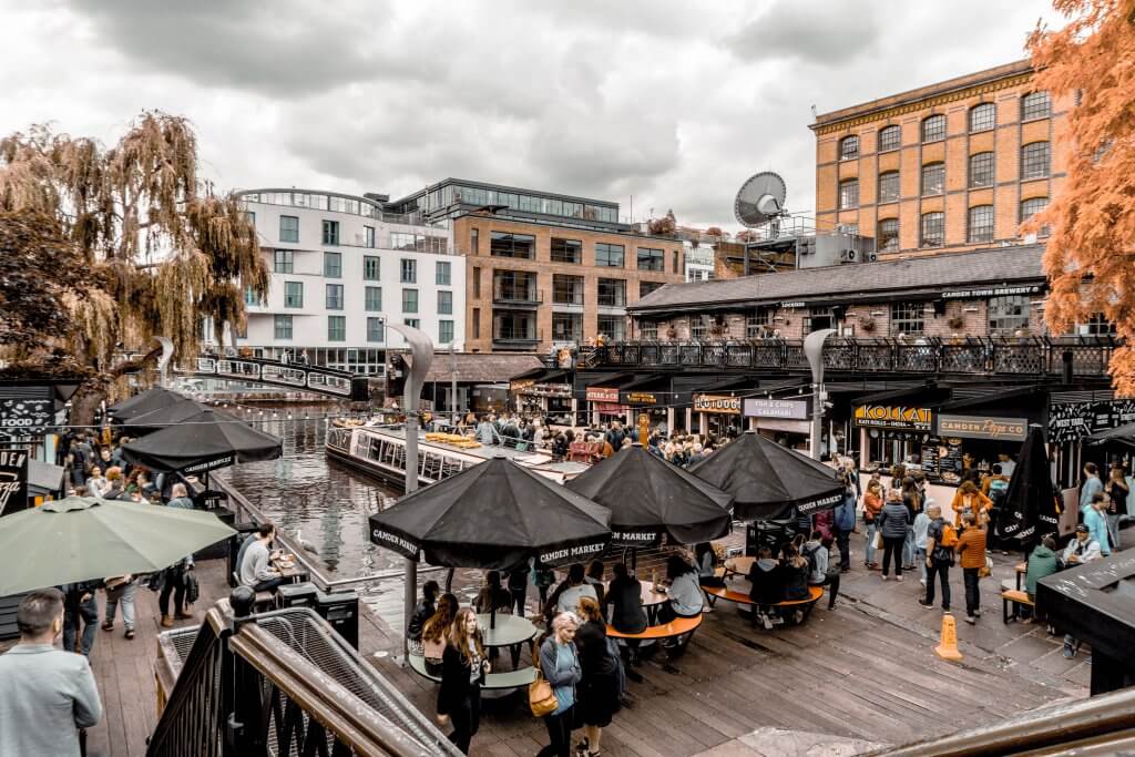 Patrons eating along the water at Camden Market