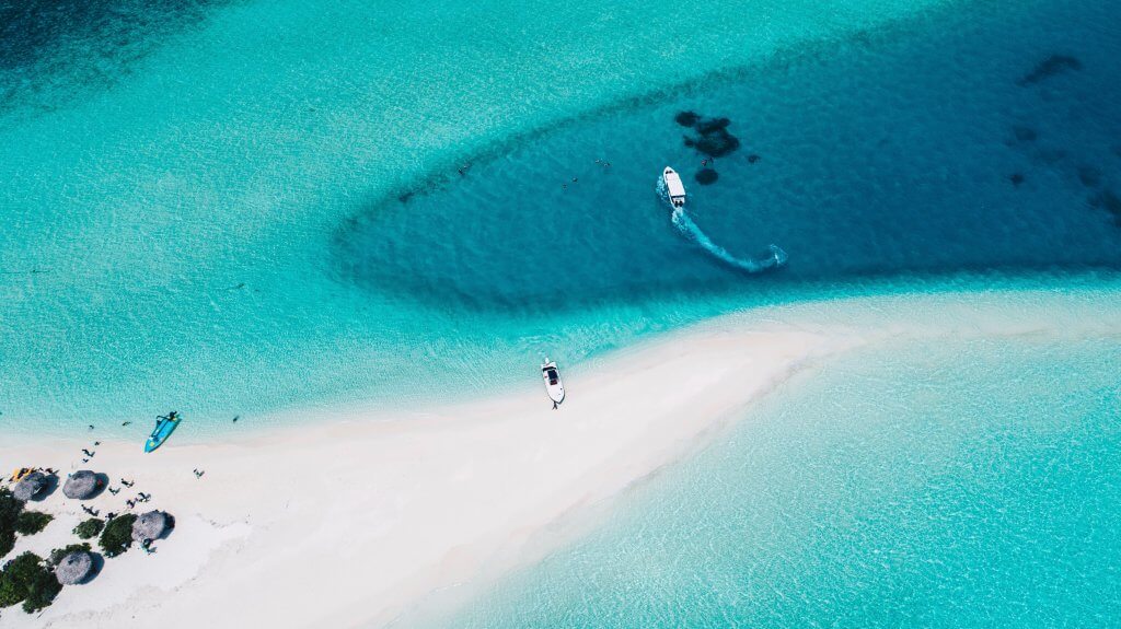 aerial view of a boat docked at a sandbank