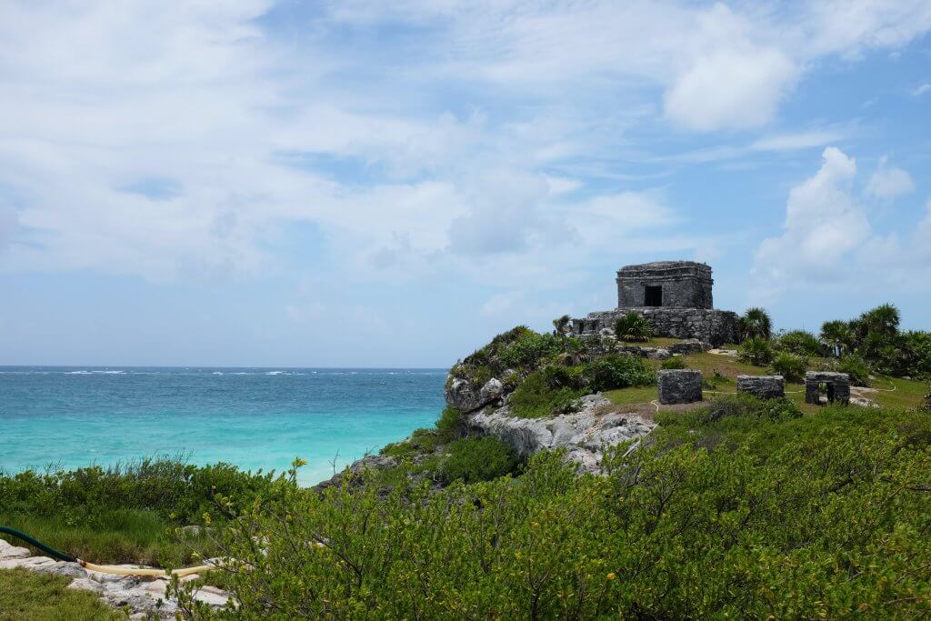 tulum ruins on a cliff overlooking the ocean