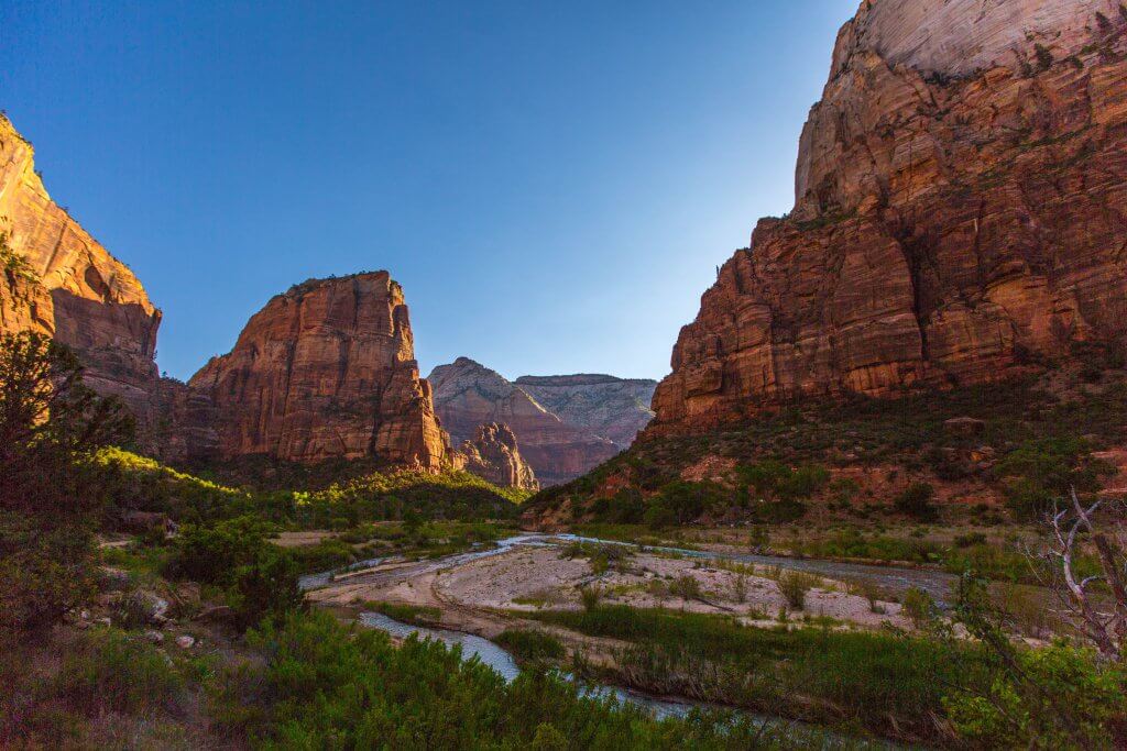 Virgin river cutting through a valley of red rock